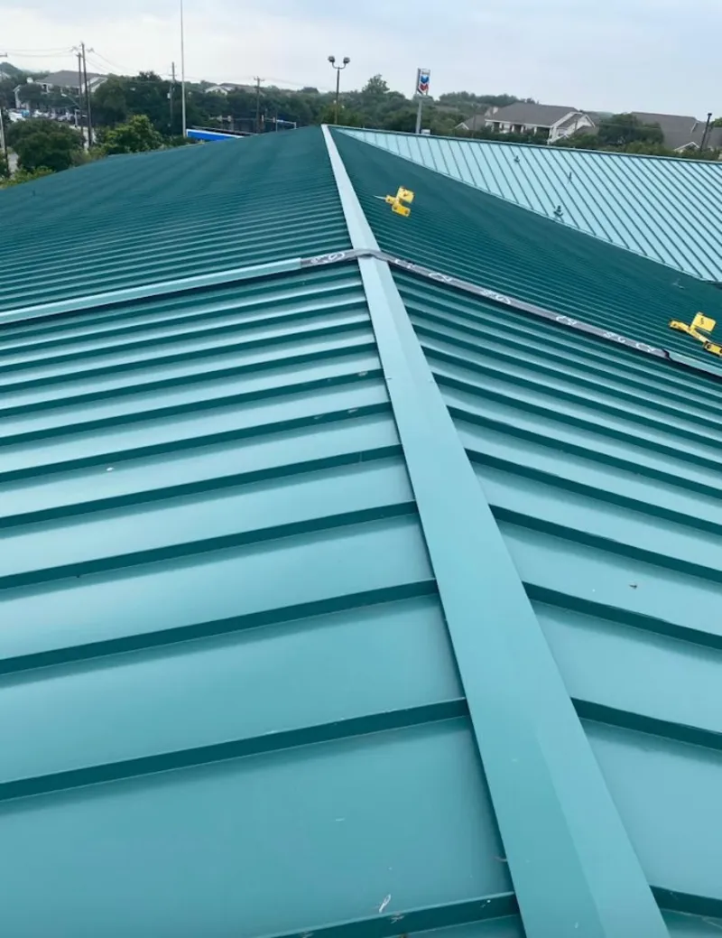 Green commercial metal roof ridge and valley for Metal Roof Repair in Howland Center