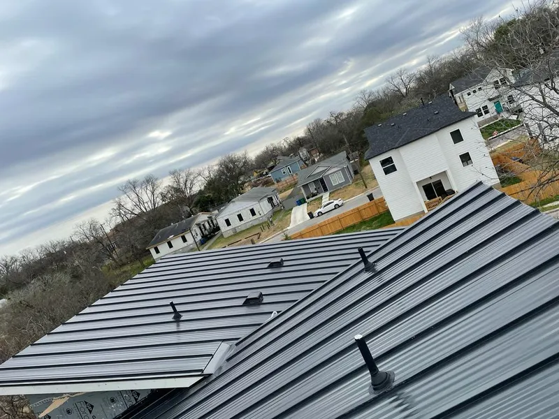 Standing seam metal roof panels with vents for Skylight Repair in Howland Center